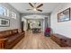 Spacious living room with wood-look tile flooring, ceiling fan, and unique décor at 208 W Amelia Ave # 1, Tampa, FL 33602