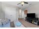Relaxing living room featuring a sofa, TV, ceiling fan, and neutral colored carpet at 208 W Amelia Ave # 1, Tampa, FL 33602