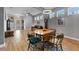 Open-concept living and dining area with hardwood style floors, lots of natural light, and comfortable seating at 208 W Amelia Ave # 1, Tampa, FL 33602