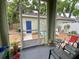 Screened-in porch with outdoor seating and a view of the backyard and detached garage at 208 W Amelia Ave # 1, Tampa, FL 33602