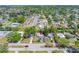 A view of the property near a pool and apartment homes in a sunny neighborhood at 217 Emerald Ln, Largo, FL 33771