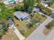 Lovely home with a long driveway, grey roof, and a spacious backyard ideal for outdoor activities at 217 Emerald Ln, Largo, FL 33771