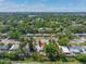 A sunny aerial view showing the home nestled in a maturely landscaped neighborhood at 217 Emerald Ln, Largo, FL 33771
