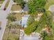 Beautiful home with mature landscaping, fenced yard, and patio area perfect for outdoor entertaining at 217 Emerald Ln, Largo, FL 33771