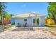 Inviting backyard featuring a cozy patio area with outdoor seating perfect for enjoying the outdoors at 217 Emerald Ln, Largo, FL 33771
