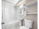 Bathroom with pedestal sink, toilet, vanity mirror, and a shower-tub combination at 217 Emerald Ln, Largo, FL 33771