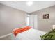 Cozy bedroom with updated flooring features closet space and neutral paint colors at 217 Emerald Ln, Largo, FL 33771