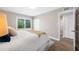 Bedroom with closet space, wood-look flooring, and sliding glass doors to the outdoors at 217 Emerald Ln, Largo, FL 33771