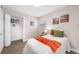 Bedroom with decor and ample closet space features updated flooring and a bright window at 217 Emerald Ln, Largo, FL 33771