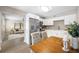 Open layout with updated kitchen appliances and a dining area, adjacent to the living room at 217 Emerald Ln, Largo, FL 33771