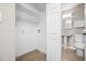 Utility room, with hook-ups for laundry and a wire rack for additional storage space at 217 Emerald Ln, Largo, FL 33771