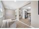 Spacious living area leading to the kitchen, with a view of the bedrooms in the background at 217 Emerald Ln, Largo, FL 33771