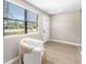 Cozy seating area near a window, offering ample natural light and a view of the outdoors at 217 Emerald Ln, Largo, FL 33771