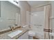 Bathroom with granite counters and white tile bathtub at 2222 Mayfield Palms Ln # 322, Sun City Center, FL 33573