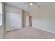 Bedroom showcasing a ceiling fan, carpeted flooring, and closet at 2222 Mayfield Palms Ln # 322, Sun City Center, FL 33573