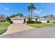 Charming home featuring a well-manicured lawn and a beautiful brick driveway and walkway at 2222 Mayfield Palms Ln # 322, Sun City Center, FL 33573