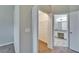 Hallway view into closet and bathroom featuring dual vanities and walk-in shower at 2222 Mayfield Palms Ln # 322, Sun City Center, FL 33573