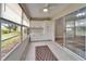 Sunroom with tile floor and lots of light at 2222 Mayfield Palms Ln # 322, Sun City Center, FL 33573