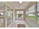 Enclosed lanai with lots of windows and a view of the backyard at 2222 Mayfield Palms Ln # 322, Sun City Center, FL 33573