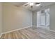 Living room with neutral paint, ceiling fan, and wood-look tile flooring at 2222 Mayfield Palms Ln # 322, Sun City Center, FL 33573