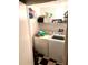 Functional laundry room with washer, dryer, and shelving at 2320 W Azeele St # 317, Tampa, FL 33609