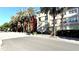 Charming street view of condo building with palm trees at 2320 W Azeele St # 317, Tampa, FL 33609