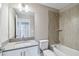 Neutral-toned bathroom showcasing a shower-over-tub design, sleek fixtures, and a quartz vanity at 2618 15Th N Ave, St Petersburg, FL 33713