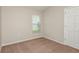 Bedroom highlighting natural light from a window and closet with neutral walls and plush carpeting at 37233 Sagemoor Dr, Zephyrhills, FL 33541