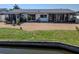 Waterfront home with a spacious gravel backyard and enclosed porch at 3729 Sail Dr, New Port Richey, FL 34652