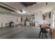 Spacious unfinished garage with overhead lighting, utility sink, and storage at 3729 Sail Dr, New Port Richey, FL 34652