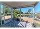Relaxing screened-in lanai with peaceful view of tranquil pond and landscaped surroundings for ultimate outdoor serenity at 3729 Sail Dr, New Port Richey, FL 34652