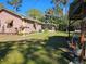 A well maintained backyard with green grass, and a screened-in porch at 402 8Th Sw St, Ruskin, FL 33570