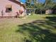 Spacious backyard featuring a shed and screened patio perfect for outdoor living and storage at 402 8Th Sw St, Ruskin, FL 33570