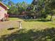 Expansive backyard with a gazebo and lush green space, offering privacy and room for outdoor activities at 402 8Th Sw St, Ruskin, FL 33570