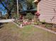Charming front yard landscaping with flowers and decorative elements adding curb appeal to the home at 402 8Th Sw St, Ruskin, FL 33570