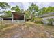 Large backyard with a covered structure, adjacent to the main house, great for storage at 403 Skywood Dr, Valrico, FL 33594