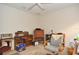 Neutral home office with desk, shelving, and comfortable chair at 4078 Salem Square Pkwy, Palm Harbor, FL 34685