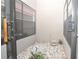 Enclosed private patio with white gravel, natural light, and decorative plant at 4078 Salem Square Pkwy, Palm Harbor, FL 34685