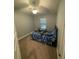 Bright bedroom with a ceiling fan, a view of the window, and a decoratively patterned bed at 6024 162Nd E Ave, Parrish, FL 34219