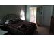 Comfortable bedroom with ensuite bathroom and natural light at 6024 162Nd E Ave, Parrish, FL 34219