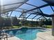 Sparkling pool with sun-catching screen, complemented by a well-maintained outdoor living space at 6024 162Nd E Ave, Parrish, FL 34219