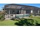 Screened-in pool with patio furniture providing a relaxing outdoor space in the backyard at 6024 162Nd E Ave, Parrish, FL 34219