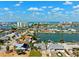 This aerial showcases waterfront homes with docks, lush lawns, and mature trees at 6410 3Rd Palm Pt, St Pete Beach, FL 33706