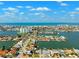 Waterfront homes are displayed in this aerial shot of a community near the ocean at 6410 3Rd Palm Pt, St Pete Beach, FL 33706