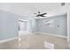 Bedroom featuring stylish ceiling fan, neutral wall color, and a bright window at 6410 3Rd Palm Pt, St Pete Beach, FL 33706