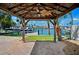 Dock and gazebo offer scenic waterfront views in a backyard that is perfect for relaxing at 6410 3Rd Palm Pt, St Pete Beach, FL 33706