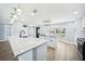 Bright, renovated kitchen with granite countertops, stainless appliances, and a large island at 6410 3Rd Palm Pt, St Pete Beach, FL 33706