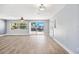 Open living space featuring sliding glass doors leading to a boat dock and water view at 6410 3Rd Palm Pt, St Pete Beach, FL 33706