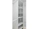 Spacious walk-in closet featuring custom shelving and ample storage space for all your wardrobe needs at 6410 3Rd Palm Pt, St Pete Beach, FL 33706