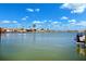 Waterfront view showcasing a serene canal lined with residences and docked boats at 6410 3Rd Palm Pt, St Pete Beach, FL 33706